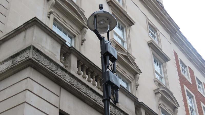 Image of two O2 Nokia FlexiZone cells on a lamppost in front of a white building